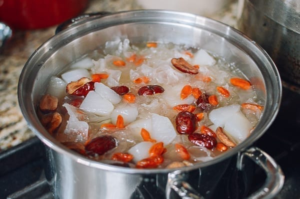 Adding dried dates, goji berries, and sugar, thewoksoflife.com