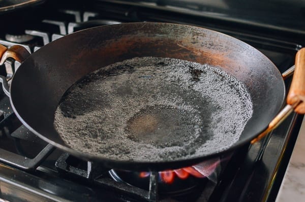 Simmering water in wok, thewoksoflife.com