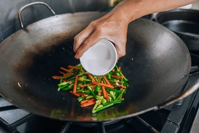 Adding cornstarch slurry to stir-fry