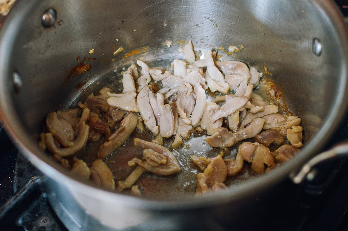 Browning chicken in pot, thewoksoflife.com