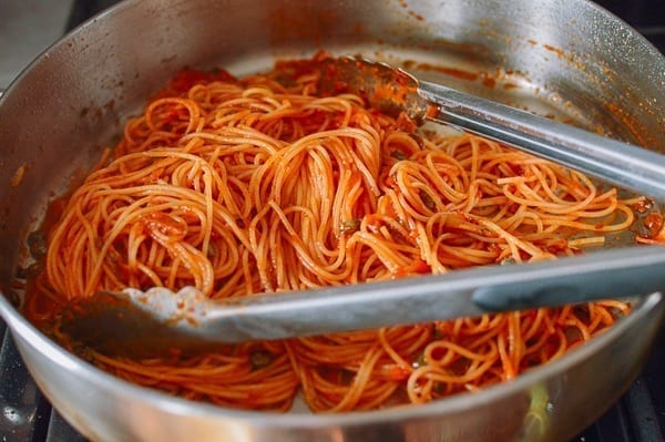 Thin coating of marinara on spaghetti, thewoksoflife.com