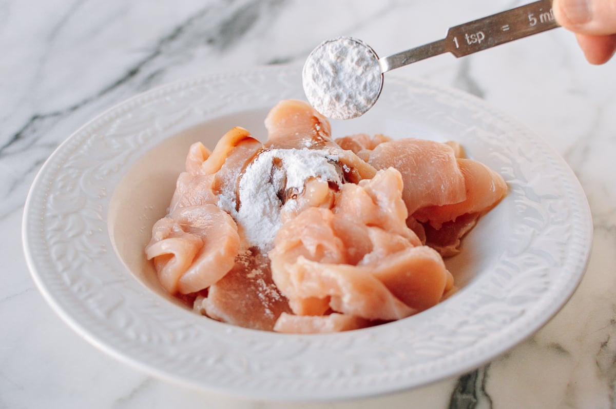 Adding cornstarch to chicken marinade, thewoksoflife.com