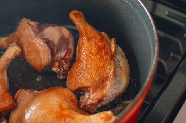 Golden brown skin on seared duck legs, thewoksoflife.com