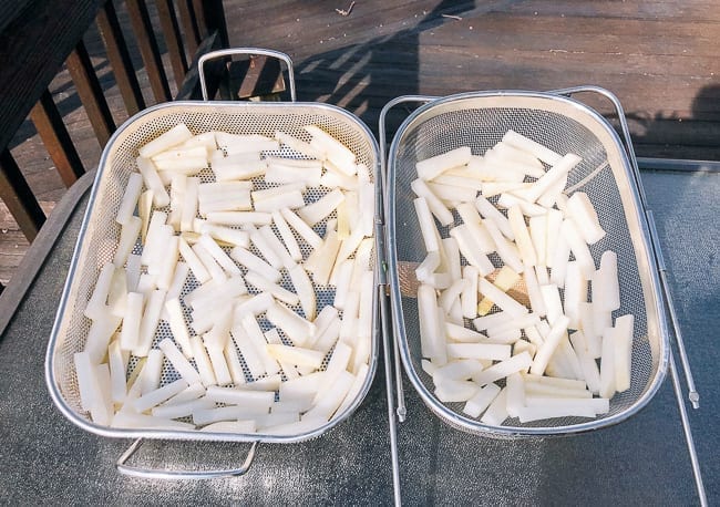 Drying salted daikon radishes in the sun, thewoksoflife.com