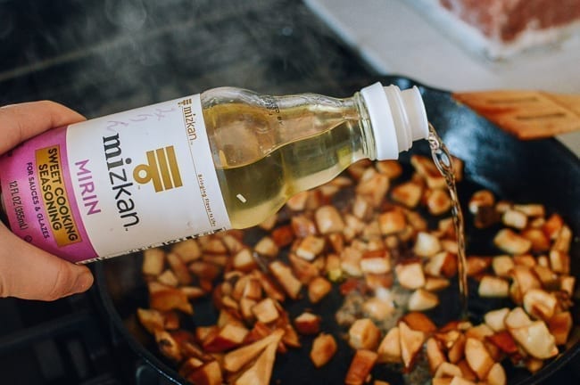 Adding Mizkan Mirin to mushrooms, thewoksoflife.com