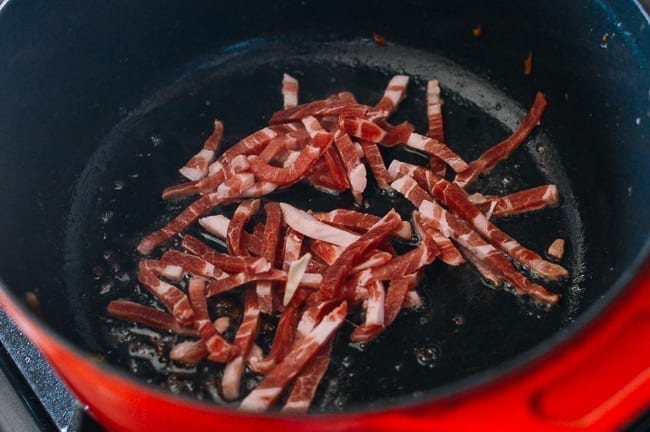 Julienned pork in pot, thewoksoflife.com