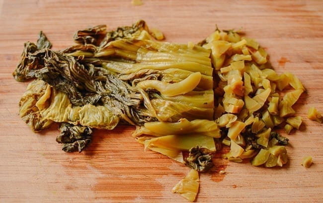 Chopping pickled mustard greens, thewoksoflife.com