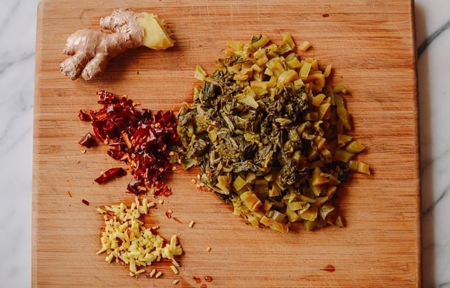 Pickled mustard green with ginger and dried chili, thewoksoflife.com