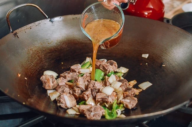 Adding pork stock, thewoksoflife.com