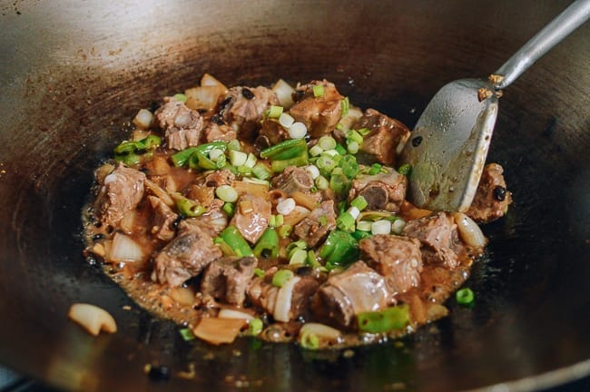 Adding chopped scallions, thewoksoflife.com