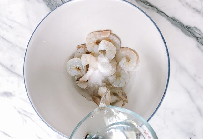 Adding ice water to shrimp, thewoksoflife.com