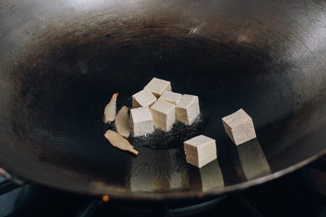 Browning tofu in wok, thewoksoflife.com