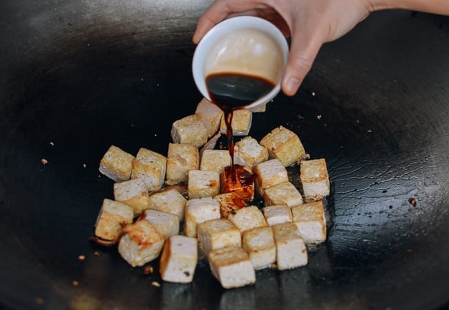 Adding Chinese black vinegar to tofu, thewoksoflife.com