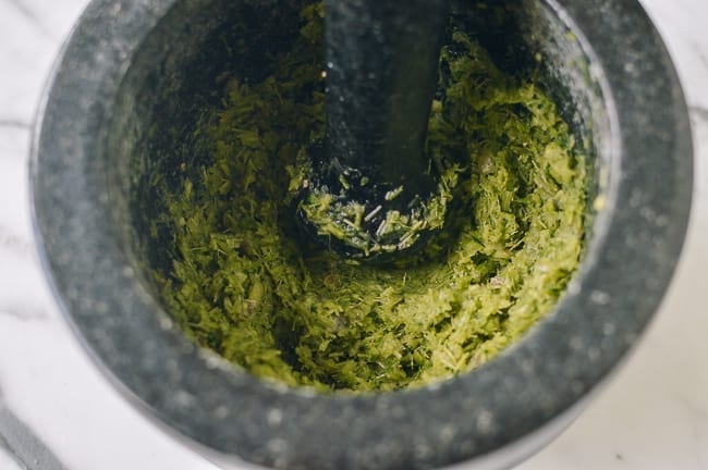 Pounded aromatics in mortar and pestle, thewoksoflife.com