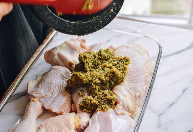 Pouring marinade over chicken pieces, thewoksoflife.com