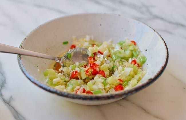 Stirring aromatics in hot oil, thewoksoflife.com