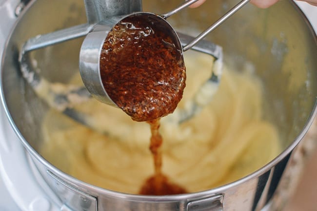 Adding Osmanthus syrup to cake batter, thewoksoflife.com