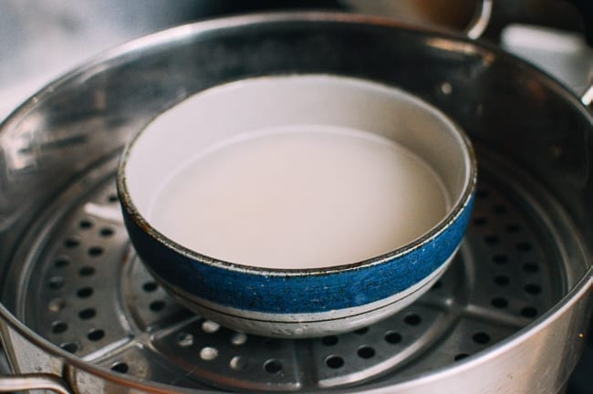 Rice and water in steamer, thewoksoflife.com