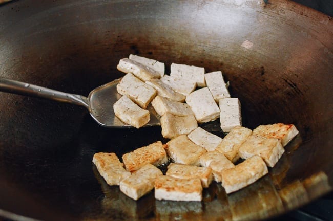 Flipping pan-fried tofu, thewoksoflife.com