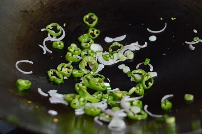 Peppers and shallots in woks, thewoksoflife.com