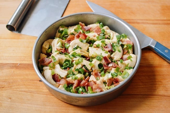 Bacon scallion filled dough in round pan