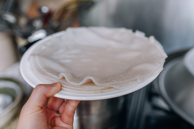 Stacking liangpi sheets, thewoksoflife.com