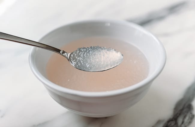 Cooked mini pearl tapioca soaking in water, thewoksoflife.com