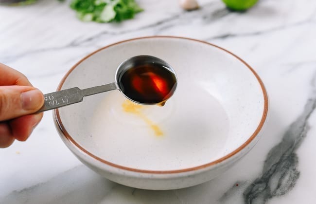 Adding fish sauce, thewoksoflife.com