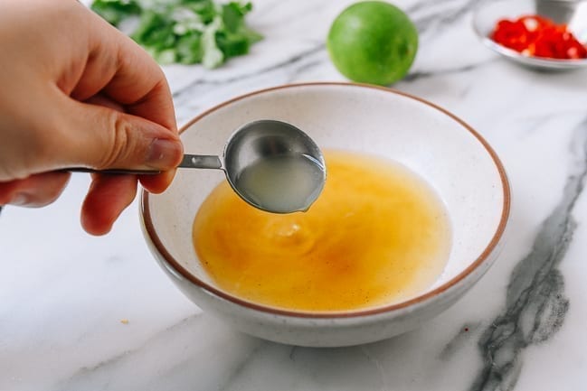 Adding lime juice, thewoksoflife.com