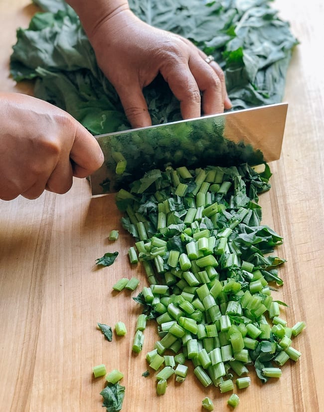 Chopping kale greens, thewoksoflife.com