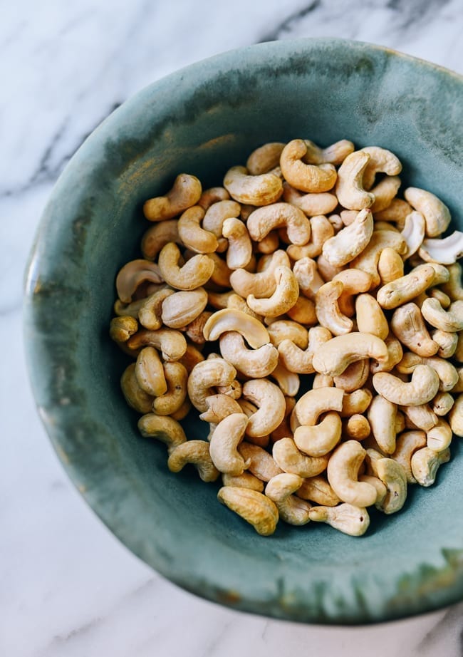 Bowl of raw cashews, thewoksoflife.com