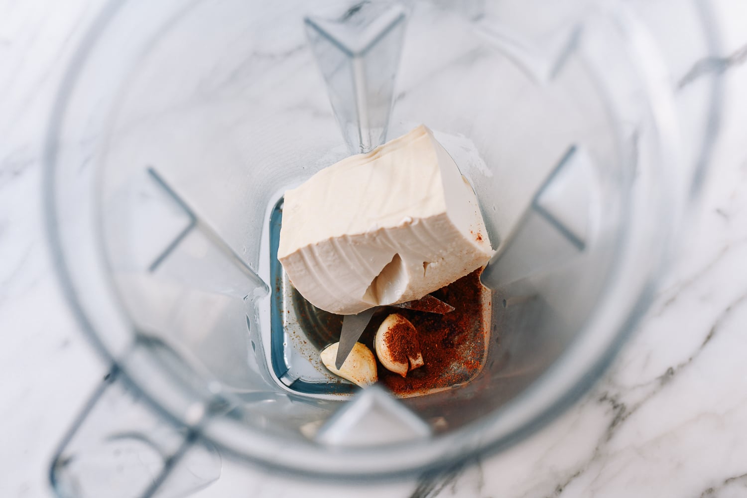 Silken tofu, cayenne, garlic, and apple cider vinegar in blender, thewoksoflife.com