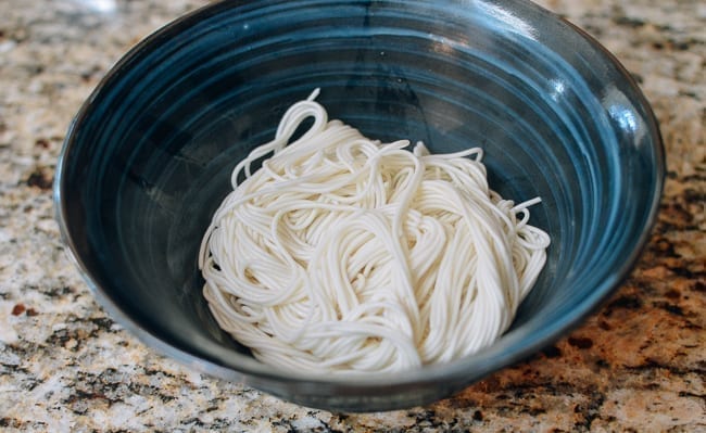 Thin Chinese noodles in soup bowl, thewoksoflife.com