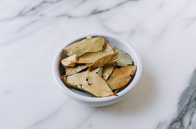 bay leaves in a small white dish