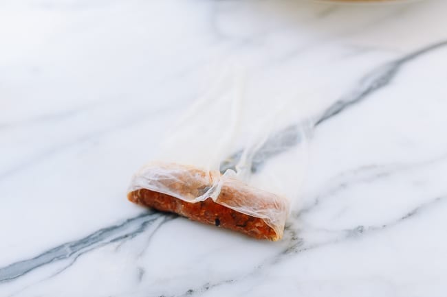 Folding sides of wrapper over filling, thewoksoflife.com