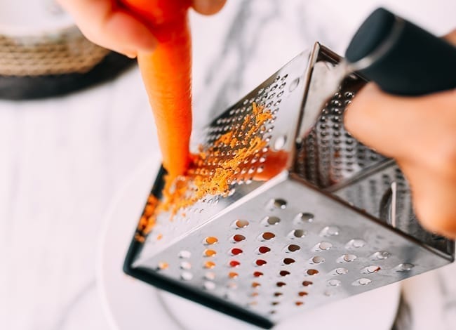 Grating carrots, thewoksoflife.com
