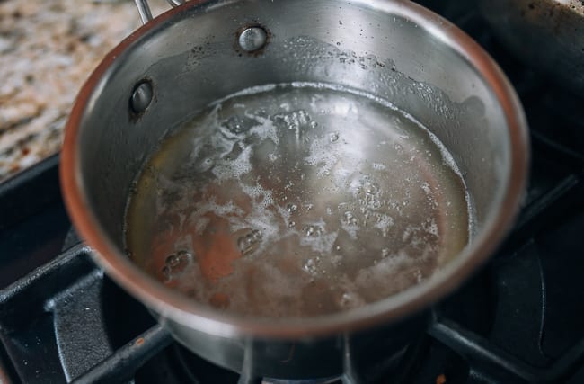 Simmering simple syrup (sugar water solution), thewoksoflife.com