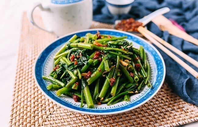 Kangkung belacan in blue and white bowl