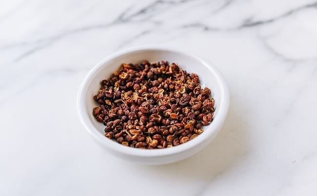 Red Sichuan Peppercorns in white dish, thewoksoflife.com