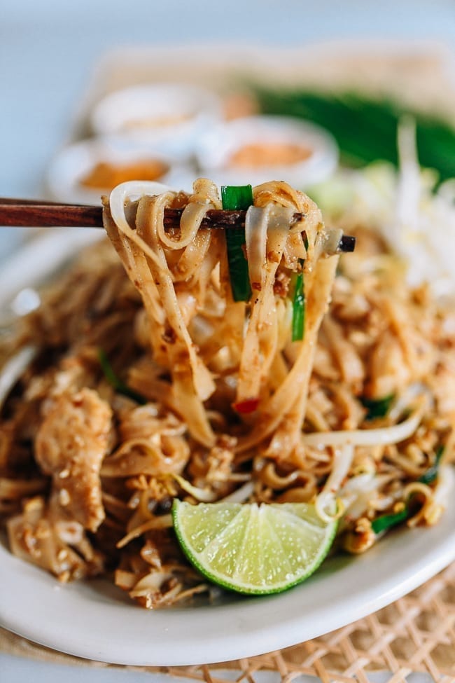 Lifting pad thai with chopsticks, thewoksoflife.com