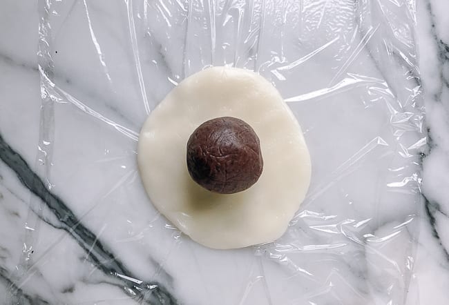 Ball of filling on disc of mochi dough, thewoksoflife.com