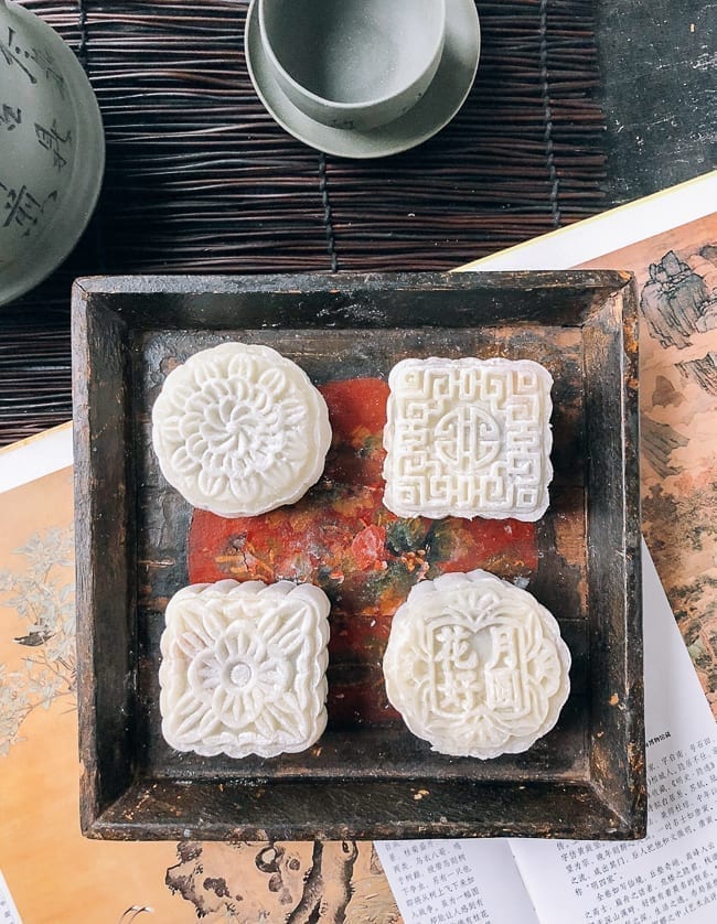 Four snow skin mooncakes on square wooden dish, thewoksoflife.com
