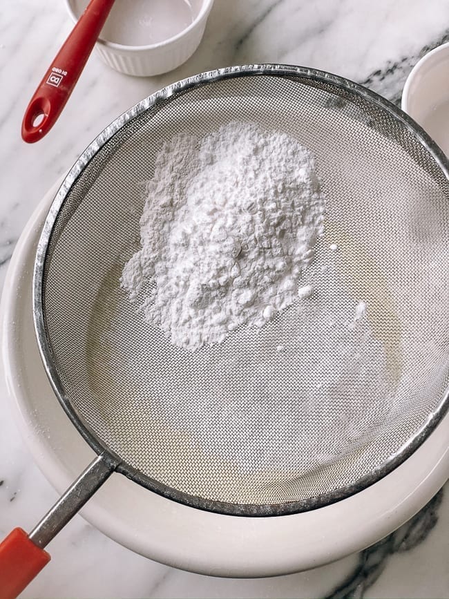 Sifting in rice flour, glutinous rice flour, and wheat starch, thewoksoflife.com