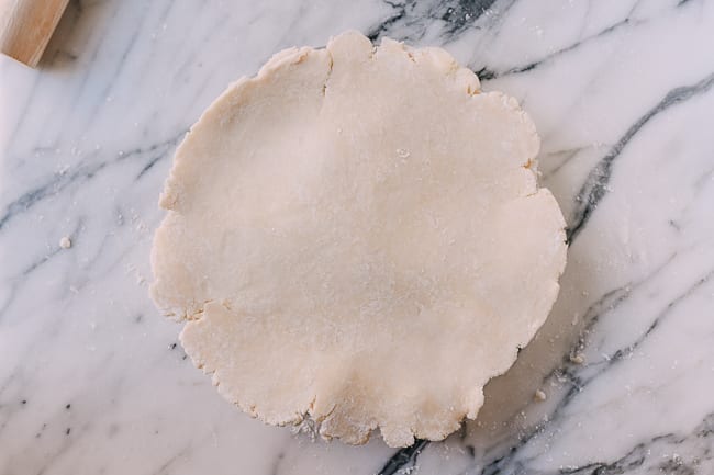 Covering pie with top crust, thewoksoflife.com