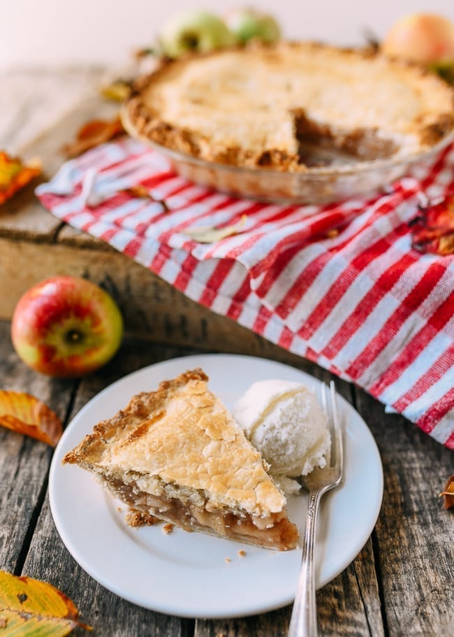 Slice of flaky apple pie with ice cream, thewoksoflife.com