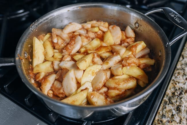 Partially cooked apple pie filling in pan, thewoksoflife.com