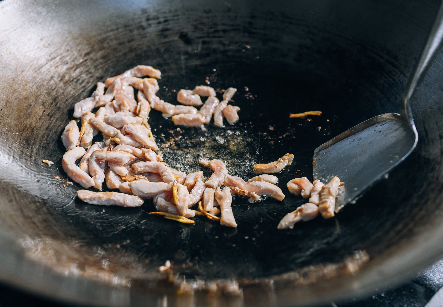 Stir-fried chicken that is just cooked through, thewoksoflife.com