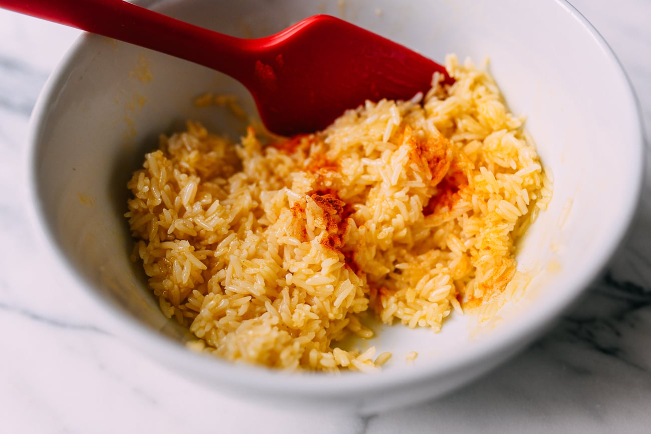 Mixing egg yolk into rice, thewoksoflife.com