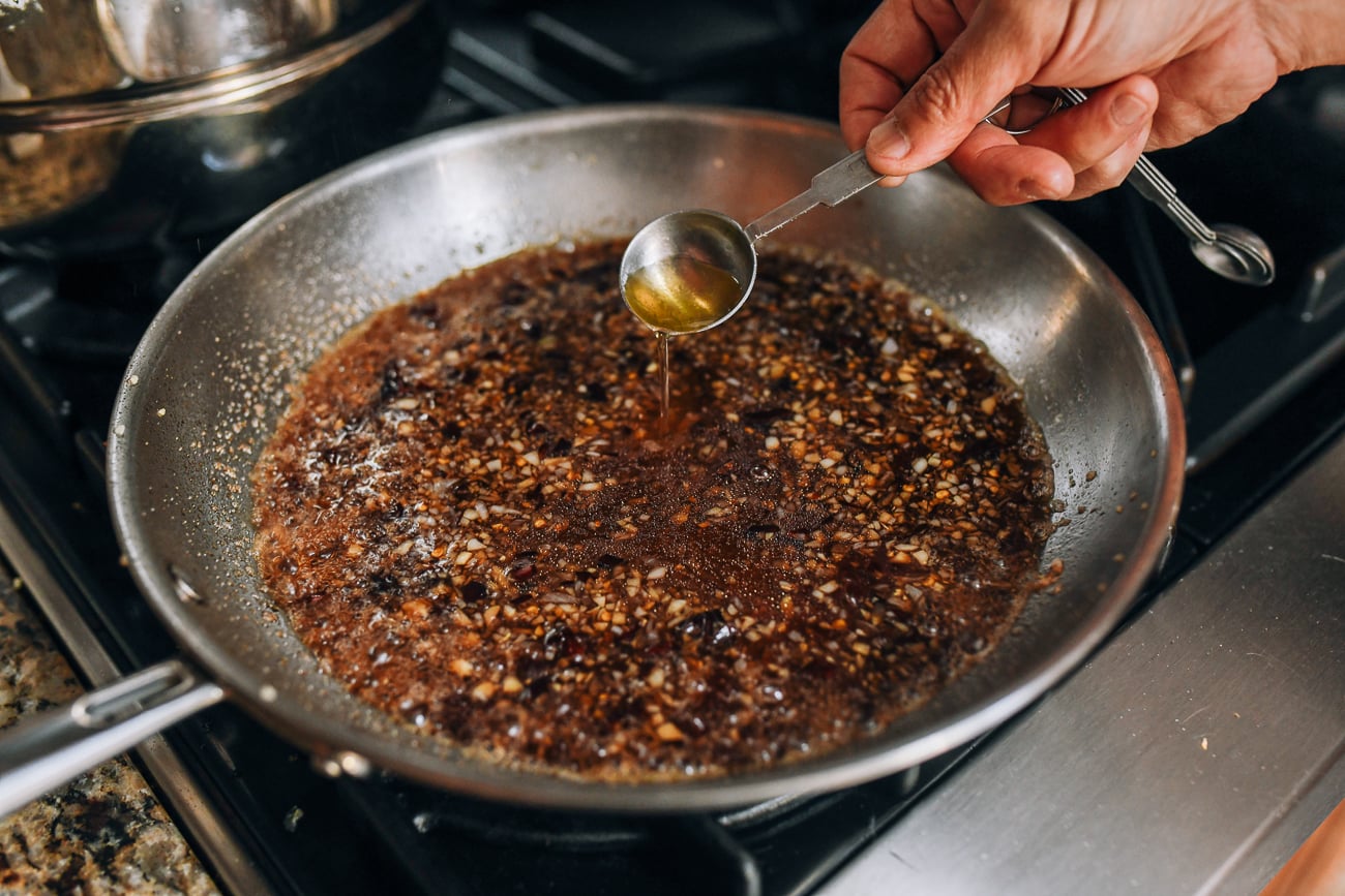 Adding rice vinegar to sauce