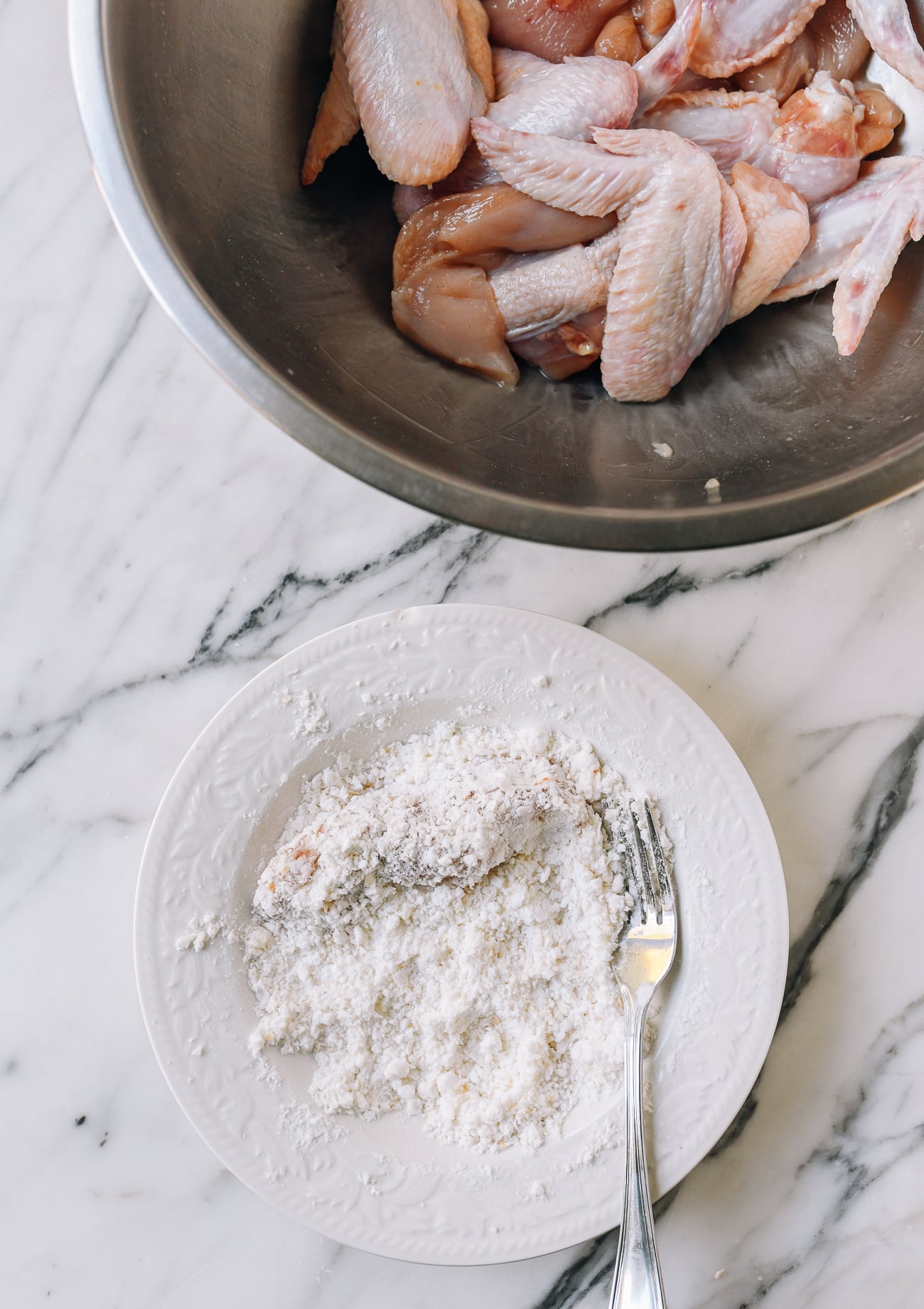 Dredging chicken in coating